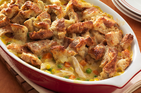 CASSEROLE DISH FILLED WITH WHITE MEAT, VEGGIES AND TOPPED WITH TOASTED BAYS ENGLISH MUFFINS