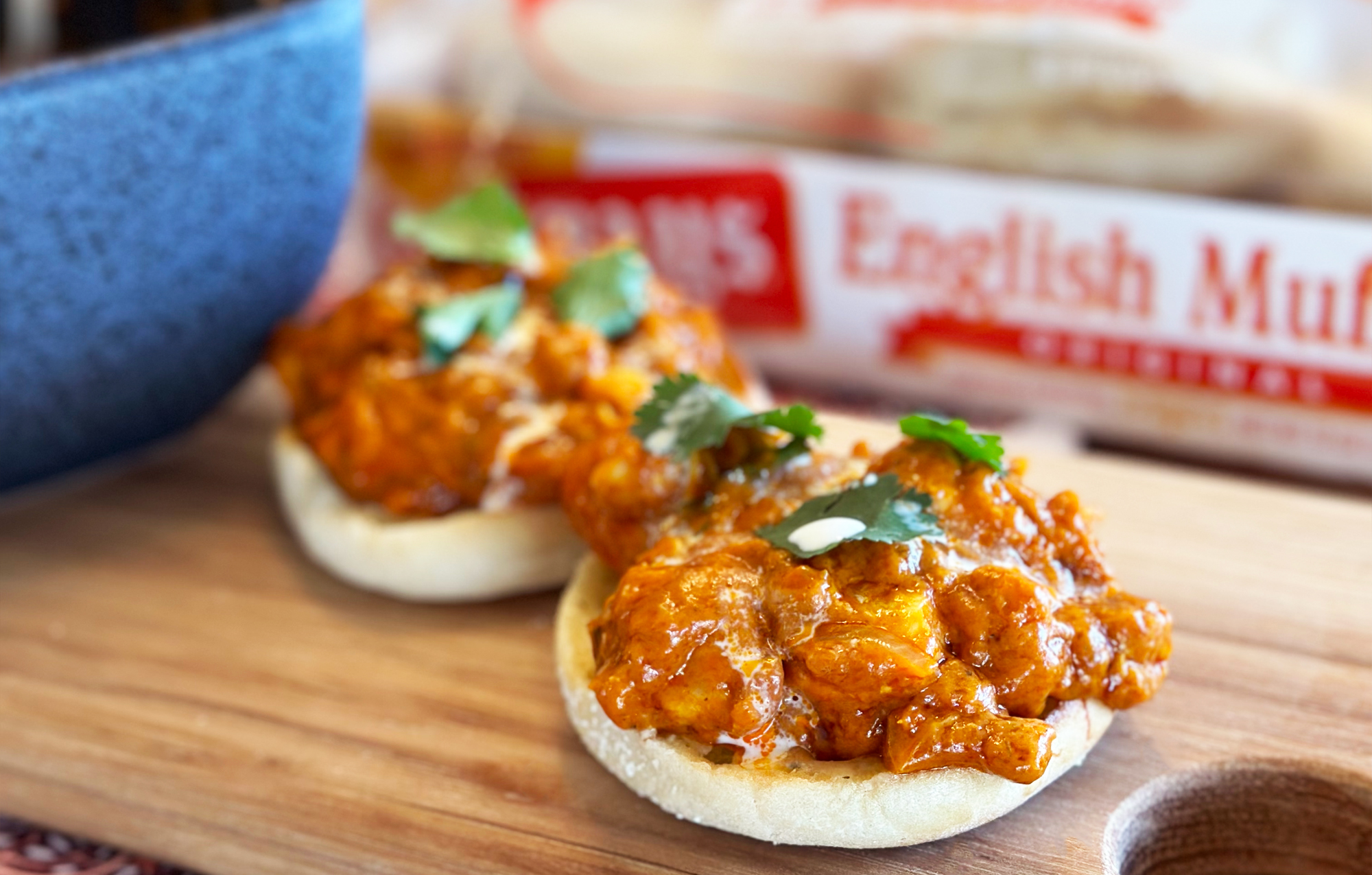 COATED CHICKEN PILED ON TWO BAYS ENGLISH MUFFINS