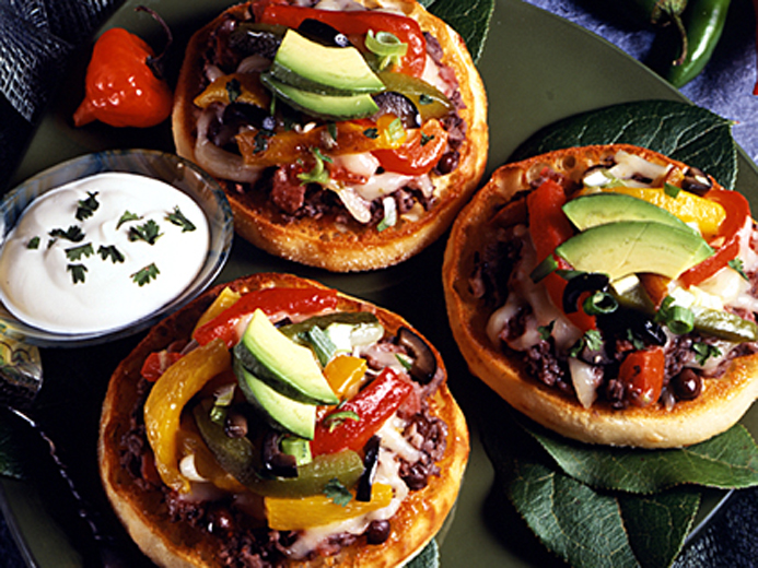 BAYS TOPPED WITH AVOCADO OLIVES AND OTHER VEGGIES