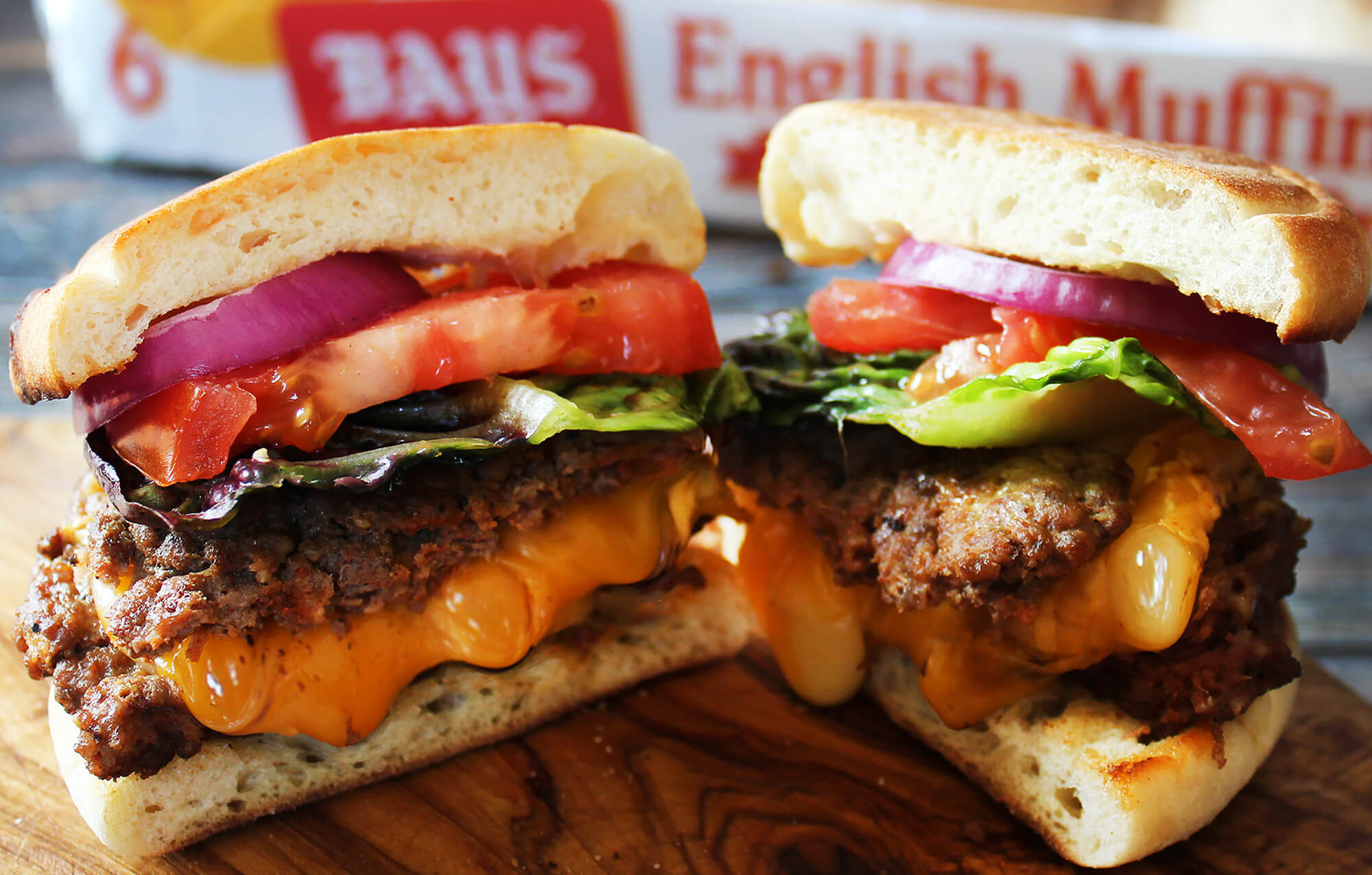 HUGE BURGER WITH CHEESE BETWEEN THE PATTIES