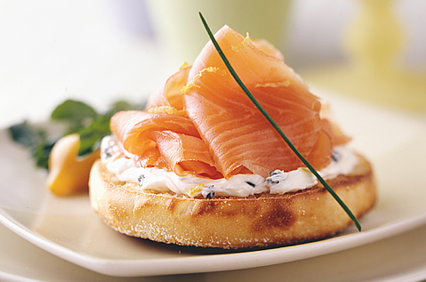 THIN STRIPS OF ORANGE FISH ON A BAYS ENGLISH MUFFIN