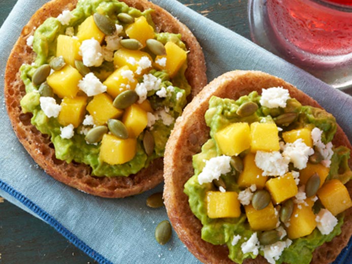 a green spread topped with fruit on Bays English Muffins