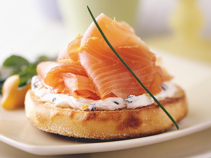 THIN STRIPS OF ORANGE FISH ON A BAYS ENGLISH MUFFIN