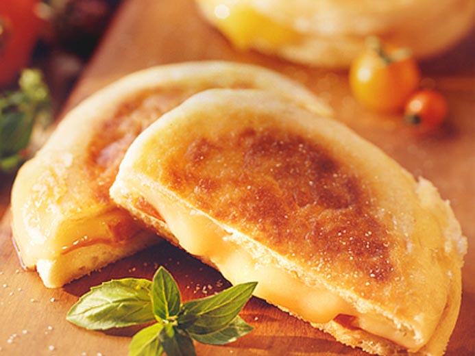 an elevated grilled ham and cheese sandwich