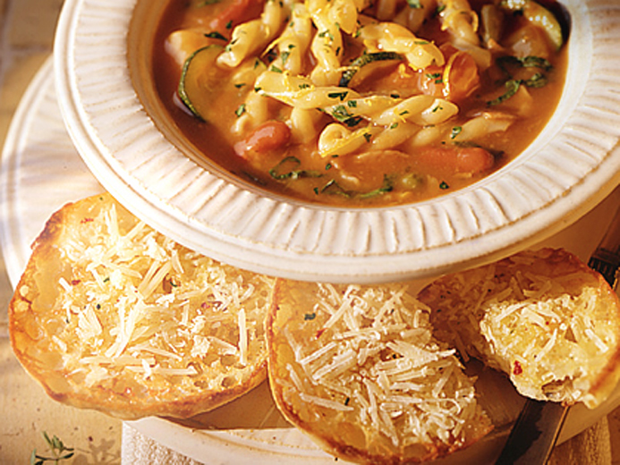 A RICH RED SOUP WITH TOASTED ENGLISH MUFFIN ON THE SIDE