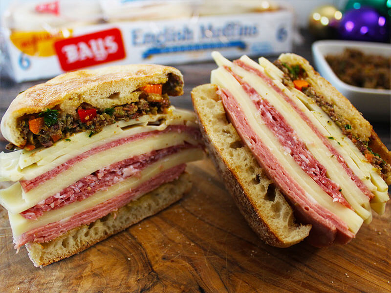 HUGE SALAD WITH A VARIETY OF DELI MEATS CHEESES AND OLIVE TAPENADE