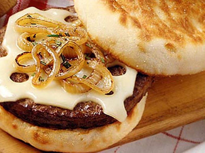 A BEEF PATTY WITH CHEESE ON A BAYS ENGLISH MUFFIN