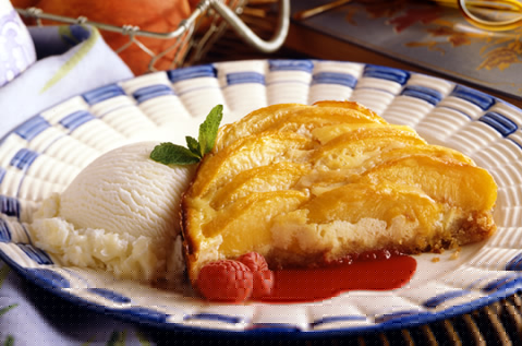 BAYS TOPPED WITH FRUIT NEXT TO A SCOOP OF ICE CREAM