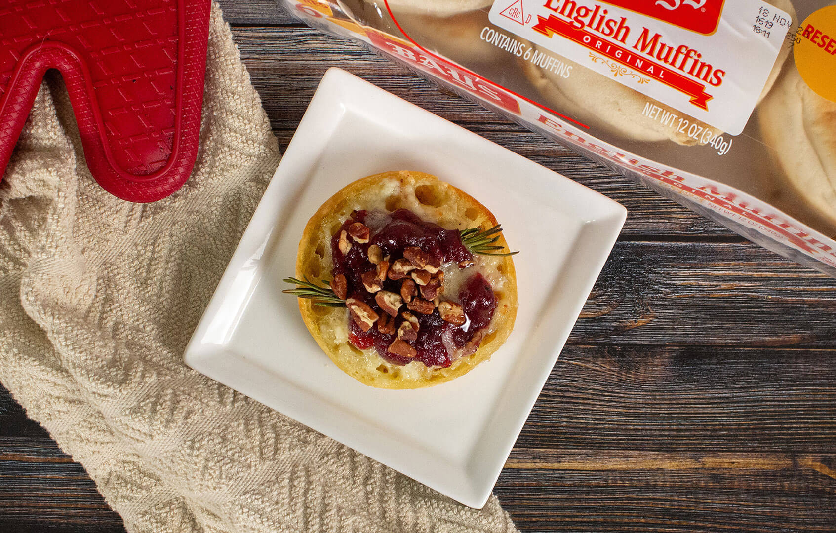 bays topped with a red fruit paste and nuts