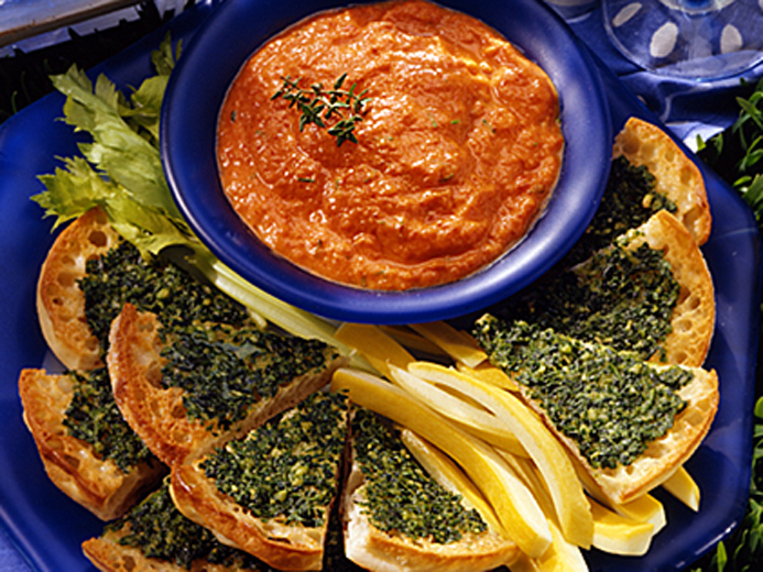 BAYS SLICED INTO WEDGES TOPPED WITH GREEN PASTE
