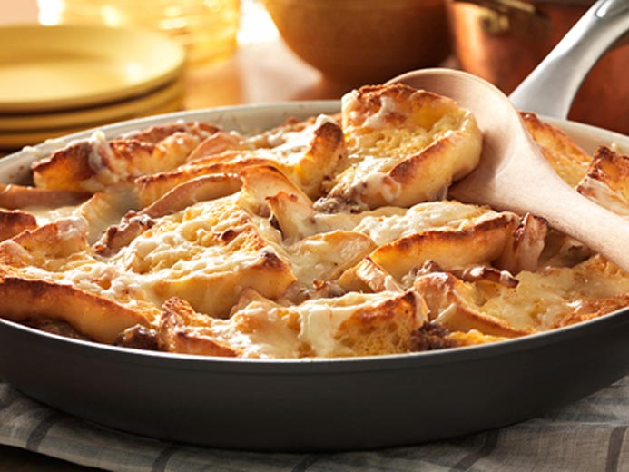 A PAN FILLED WITH BAYS ENGLISH MUFFINS, MEAT, AND MELTED CHEESE