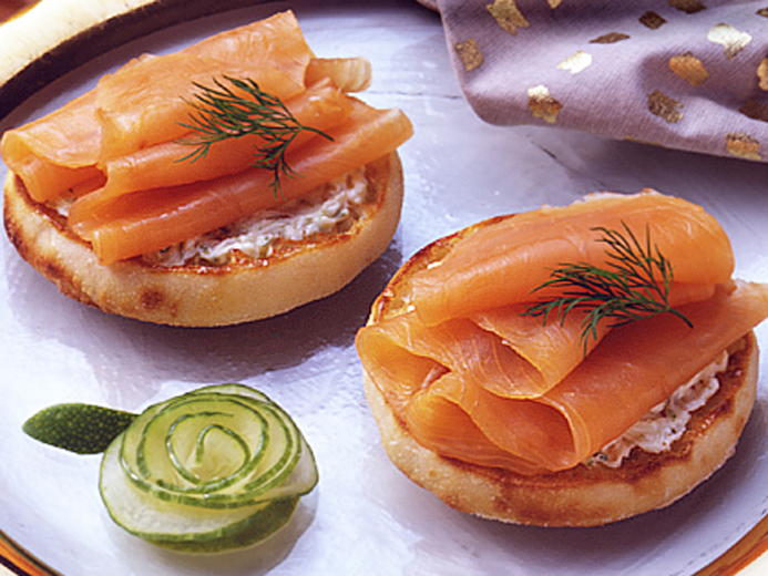 THIN STRIPS OF ORANGE FISH ON A BAYS ENGLISH MUFFIN