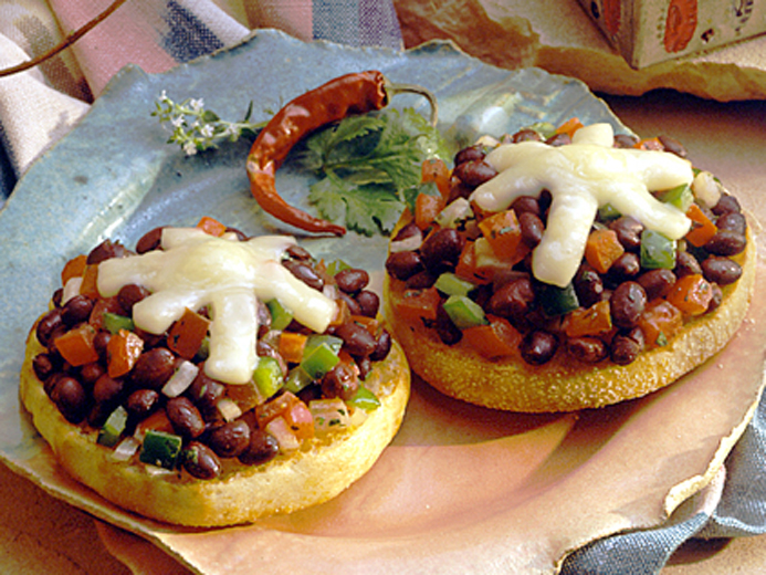 BAYS TOPPED WITH BLACK BEAN SALSA AND CHEESE