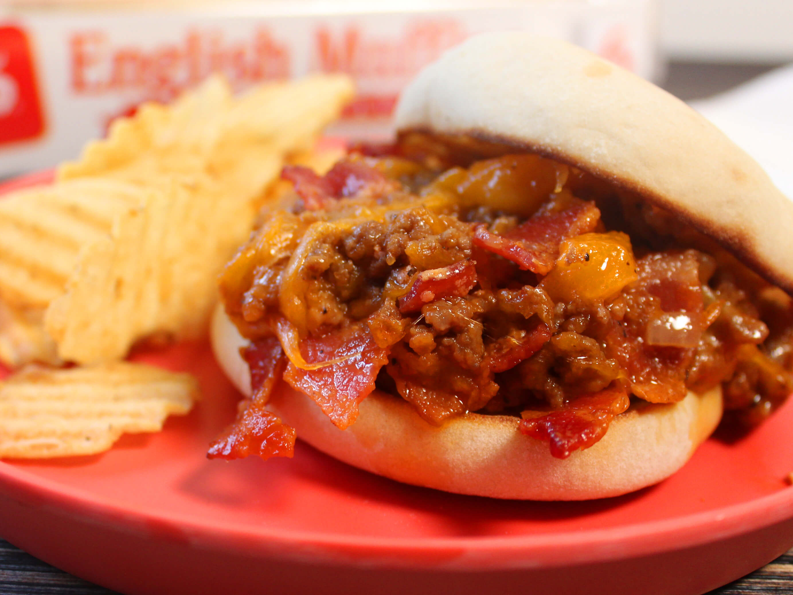 BAYS MIXED MEAT SANDWICH ON A RED PLATE WITH CHIPS