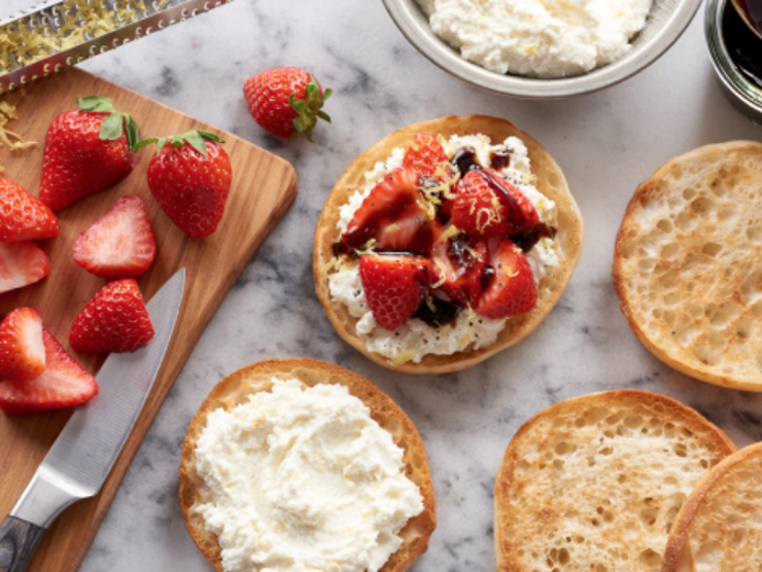 Bays english muffins topped with white cheese and red fruit