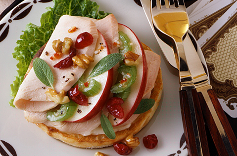 SLICED DELI MEAT WITH CRANDBERRIES AND WALNUTS ON BAYS ENGLISH MUFFINS